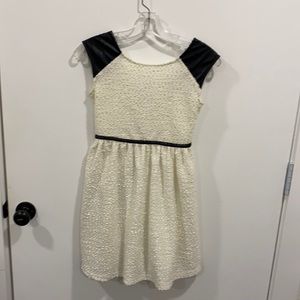 Girls sz 10 - cream and black dress- has a shimmer with faux leather detail.